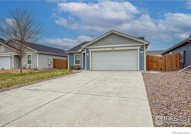 702 S Fulton Ave, Fort Lupton, CO 80621 - ranch-style home featuring driveway and an attached garage