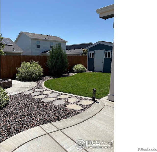 702 S Fulton Ave, Fort Lupton, CO 80621 - view of yard with a storage unit and a patio