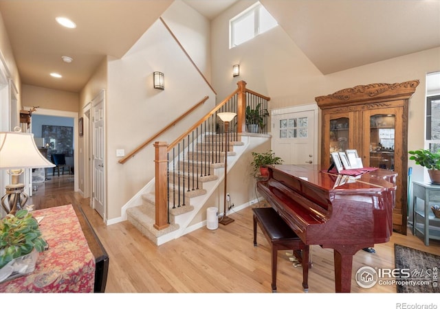 229 Rustic Rd, Bellvue, CO 80512 - staircase with wood finished floors, recessed lighting, and a high ceiling