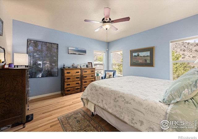229 Rustic Rd, Bellvue, CO 80512 - bedroom with wood finished floors and ceiling fan