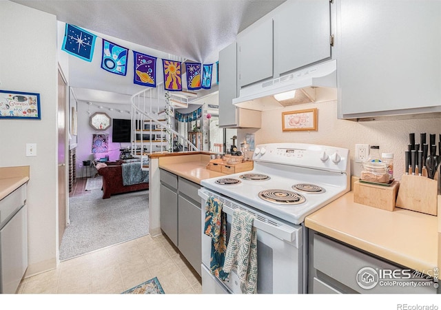 4501 E Boardwalk Dr Unit A9, Fort Collins, CO 80525 - kitchen featuring gray cabinets, open floor plan, light countertops, under cabinet range hood, and electric stove