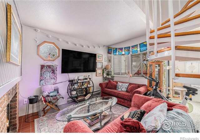 4501 E Boardwalk Dr Unit A9, Fort Collins, CO 80525 - living room with a textured ceiling and a fireplace