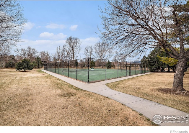 4501 E Boardwalk Dr Unit A9, Fort Collins, CO 80525 - view of tennis court with fence and a lawn