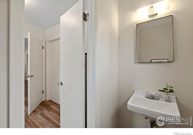 bathroom featuring a sink and wood finished floors