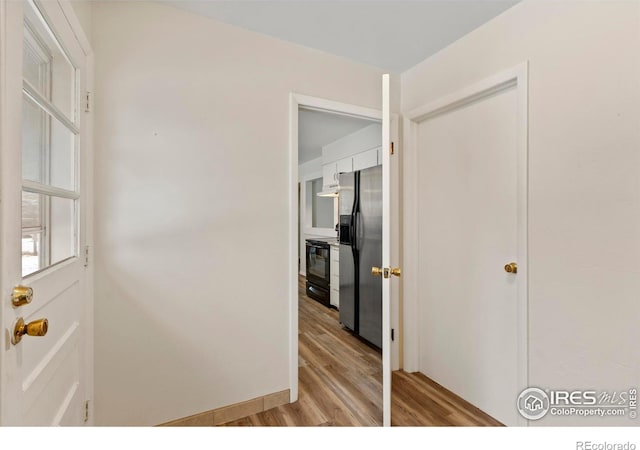 hallway featuring light wood finished floors