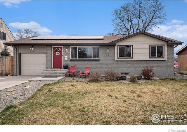 9331 Irving St, Westminster, CO 80031 - ranch-style house featuring driveway, a garage, solar panels, and a front yard