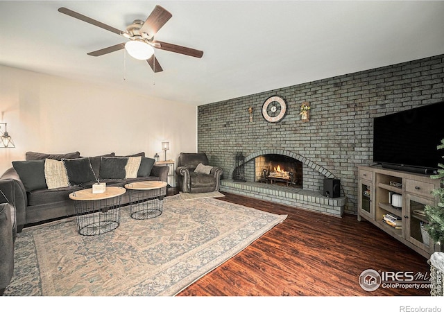 9331 Irving St, Westminster, CO 80031 - living room featuring ceiling fan, wood finished floors, and a brick fireplace
