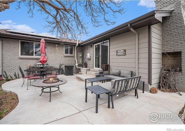9331 Irving St, Westminster, CO 80031 - view of patio featuring an outdoor living space with a fire pit and outdoor dining area