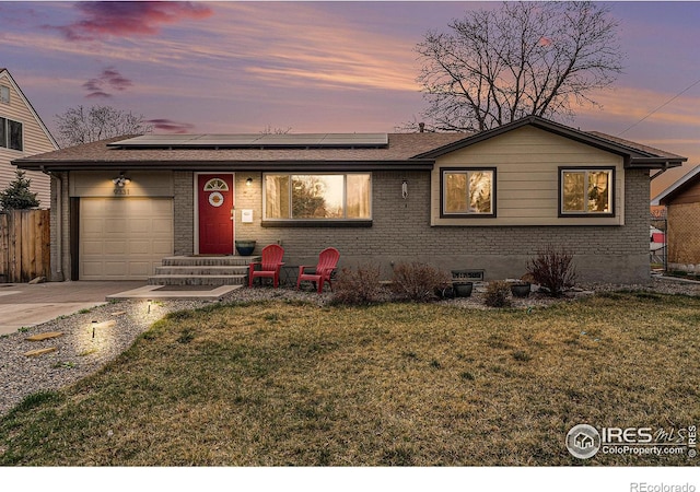 9331 Irving St, Westminster, CO 80031 - ranch-style home featuring driveway, a front yard, an attached garage, and brick siding
