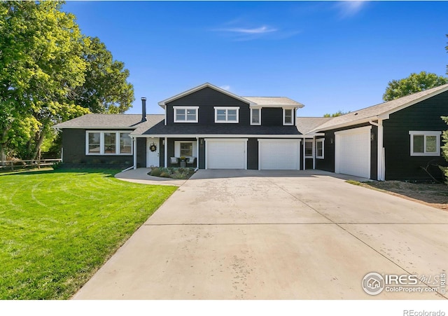 2017 Harmony Dr, Fort Collins, CO 80525 - view of front of house with a front lawn and driveway