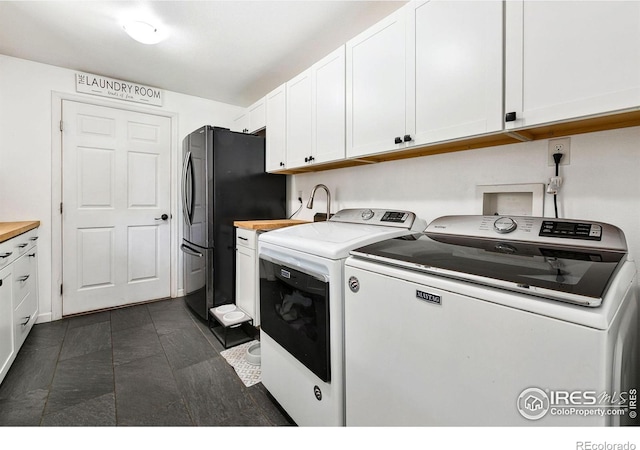 2017 Harmony Dr, Fort Collins, CO 80525 - washroom with a sink, cabinet space, and separate washer and dryer