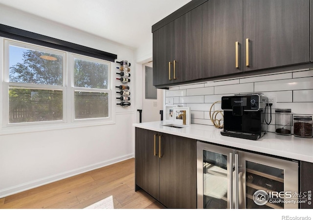 2017 Harmony Dr, Fort Collins, CO 80525 - kitchen with light countertops, backsplash, a healthy amount of sunlight, and dark brown cabinets