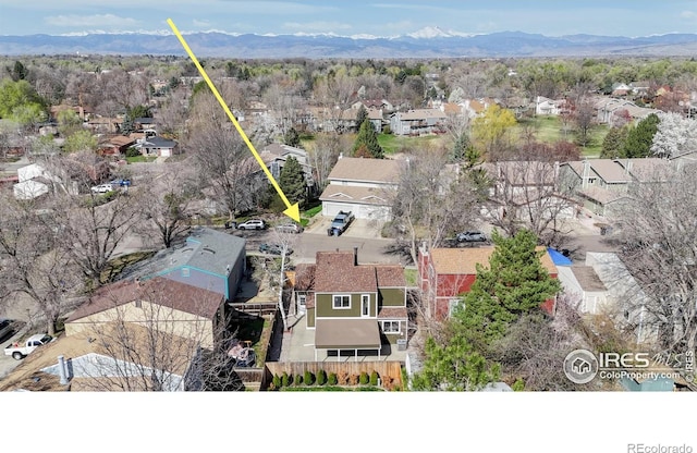 birds eye view of property featuring a mountain view and a residential view