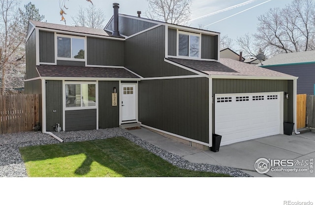 view of front facade featuring an attached garage, fence, a shingled roof, and concrete driveway