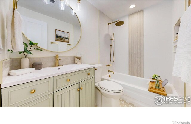 full bath with backsplash, toilet, shower / bath combination, and vanity