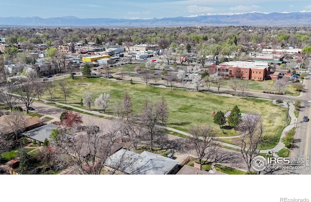 birds eye view of property featuring a mountain view