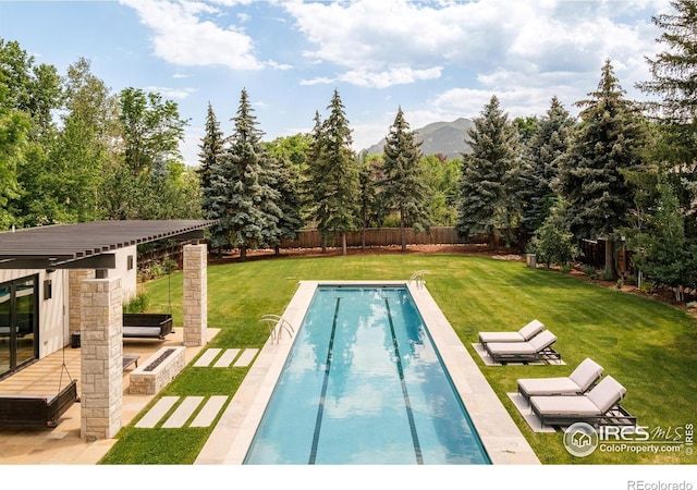 706 Juniper Ave, Boulder, CO 80304 - view of swimming pool featuring a fenced backyard, a patio area, and a mountain view