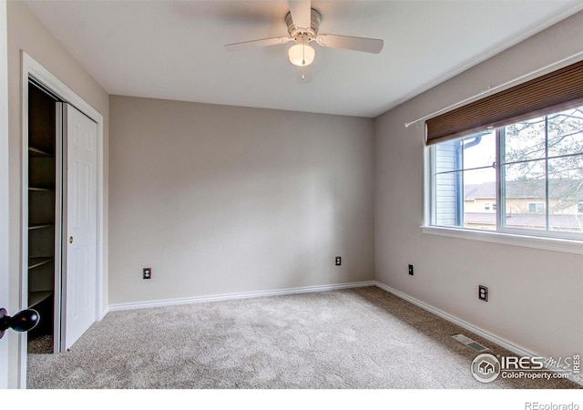 828 Kane Dr Unit 35, Longmont, CO 80501 - spare room featuring carpet flooring, a ceiling fan, and baseboards