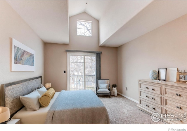 828 Kane Dr Unit 35, Longmont, CO 80501 - bedroom featuring light carpet, high vaulted ceiling, and baseboards