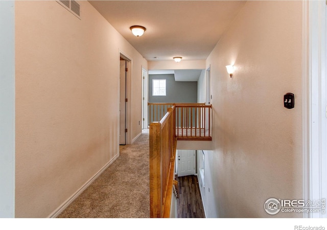 828 Kane Dr Unit 35, Longmont, CO 80501 - hall featuring an upstairs landing, baseboards, and carpet floors