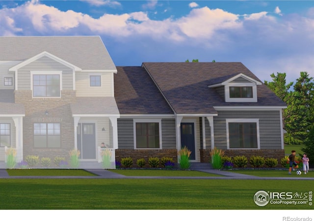 4284 Trapper Lake Dr, Loveland, CO 80538 - view of front of house with a front lawn and stone siding