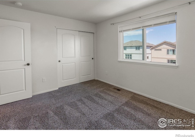 2113 Day Spring Dr, Windsor, CO 80550 - unfurnished bedroom with carpet, baseboards, and a closet