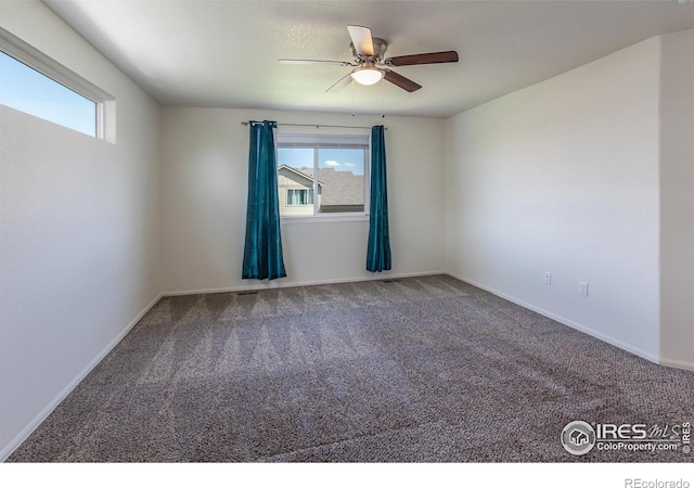 2113 Day Spring Dr, Windsor, CO 80550 - spare room featuring ceiling fan, carpet floors, and baseboards