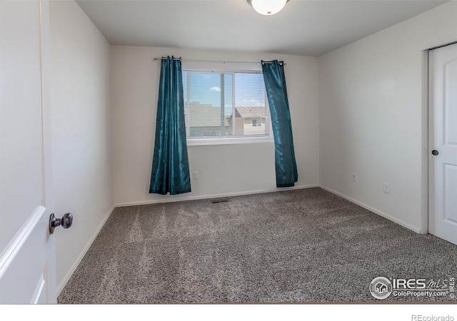 2113 Day Spring Dr, Windsor, CO 80550 - empty room featuring carpet flooring and baseboards