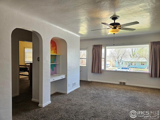 2211 10th Ave, Greeley, CO 80631 - unfurnished bedroom with visible vents, baseboards, carpet, and a textured ceiling