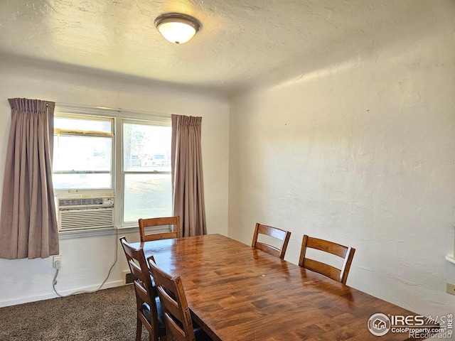 2211 10th Ave, Greeley, CO 80631 - carpeted dining area with cooling unit, a textured wall, and a textured ceiling