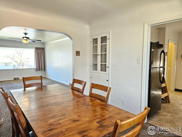 2211 10th Ave, Greeley, CO 80631 - dining room with arched walkways, a ceiling fan, and visible vents