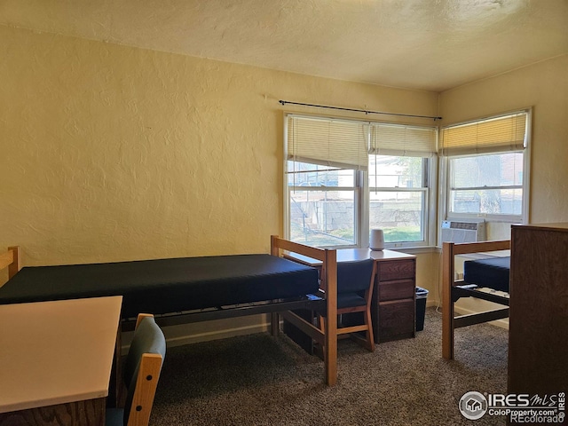 2211 10th Ave, Greeley, CO 80631 - carpeted bedroom with cooling unit, a textured wall, and a textured ceiling