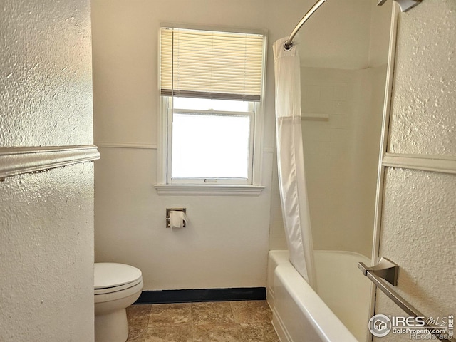 2211 10th Ave, Greeley, CO 80631 - full bath featuring toilet and shower / bath combo with shower curtain