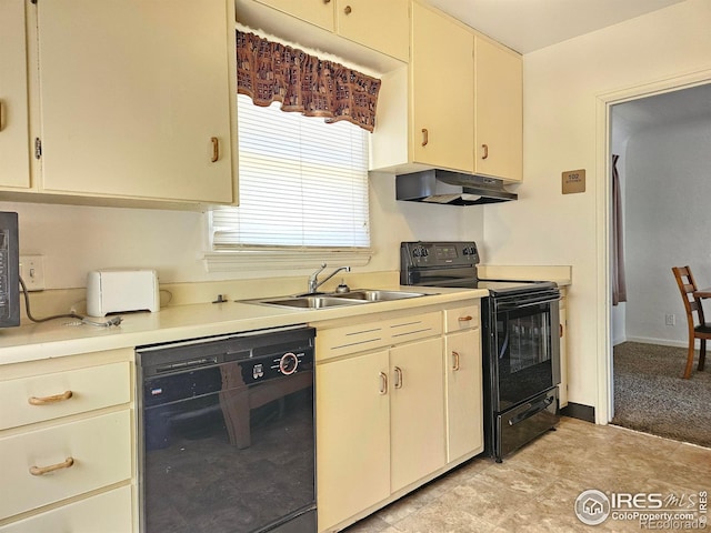 2211 10th Ave, Greeley, CO 80631 - kitchen with light countertops, cream cabinets, black appliances, under cabinet range hood, and a sink