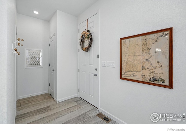 1365 Shale Dr, Erie, CO 80516 - foyer featuring light wood-style floors, baseboards, and recessed lighting