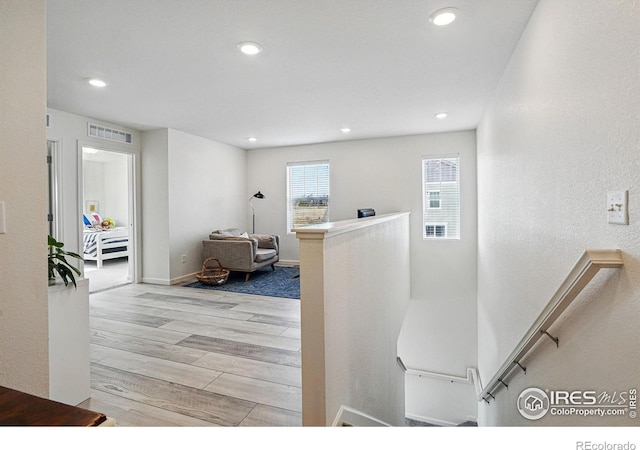 1365 Shale Dr, Erie, CO 80516 - corridor with an upstairs landing, wood finished floors, and recessed lighting