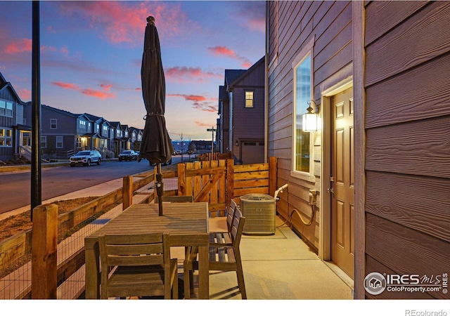 1365 Shale Dr, Erie, CO 80516 - patio terrace at dusk with outdoor dining area and a residential view