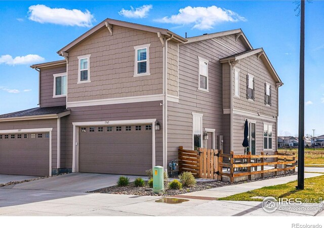 1365 Shale Dr, Erie, CO 80516 - townhome / multi-family property with a garage and concrete driveway