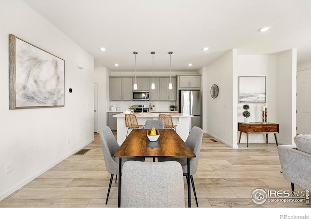 1365 Shale Dr, Erie, CO 80516 - dining area featuring light wood-style flooring, recessed lighting, and baseboards