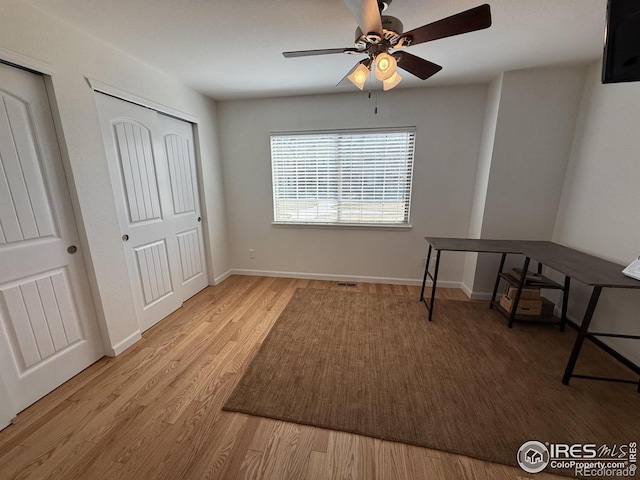 585 Callisto Dr, Loveland, CO 80537 - bedroom with ceiling fan, visible vents, baseboards, and wood finished floors