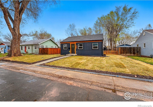 234 Lyons St, Fort Collins, CO 80521 - view of front of property with a front yard and fence