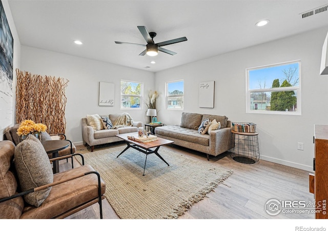 234 Lyons St, Fort Collins, CO 80521 - living room featuring visible vents, baseboards, a ceiling fan, light wood-style floors, and recessed lighting