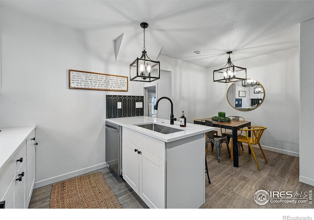 234 Lyons St, Fort Collins, CO 80521 - kitchen featuring stainless steel dishwasher, a peninsula, a sink, and an inviting chandelier