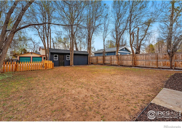 234 Lyons St, Fort Collins, CO 80521 - view of yard featuring an outbuilding and a fenced backyard