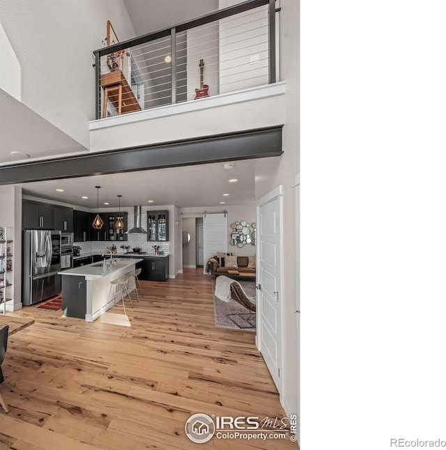 381 Pilsner St, Fort Collins, CO 80524 - interior space featuring recessed lighting, a towering ceiling, and light wood-style flooring