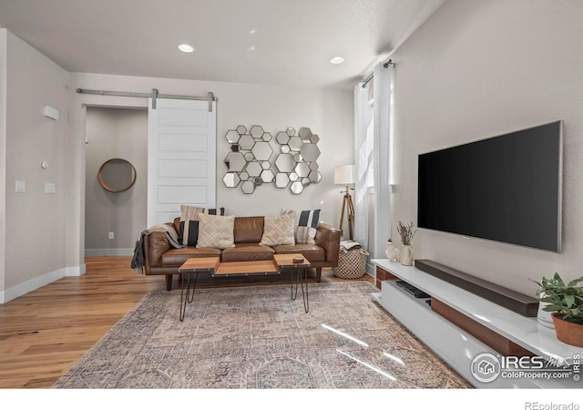 381 Pilsner St, Fort Collins, CO 80524 - living room featuring baseboards, recessed lighting, a barn door, and wood finished floors
