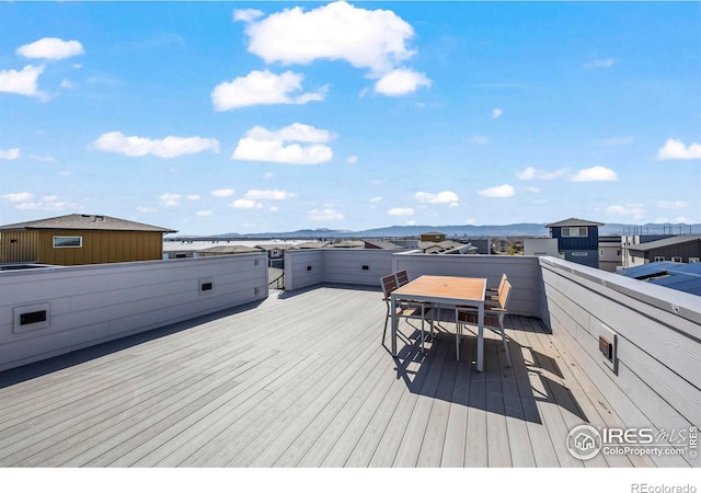 381 Pilsner St, Fort Collins, CO 80524 - wooden terrace featuring a mountain view and outdoor dining area