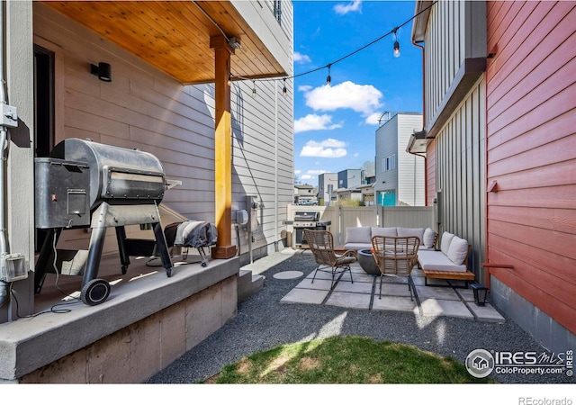 381 Pilsner St, Fort Collins, CO 80524 - view of patio / terrace with an outdoor living space and fence