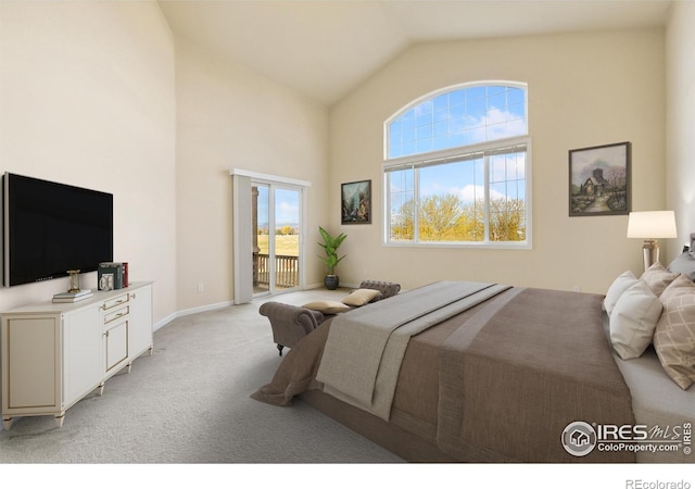 7747 Promontory Dr, Windsor, CO 80528 - bedroom featuring access to exterior, light carpet, multiple windows, high vaulted ceiling, and baseboards