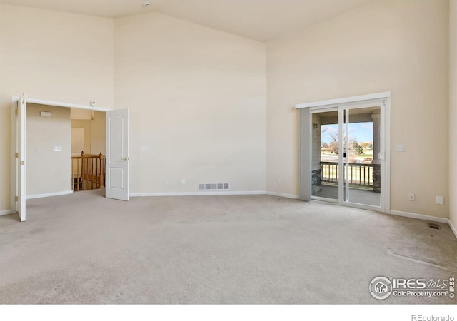 7747 Promontory Dr, Windsor, CO 80528 - unfurnished room featuring high vaulted ceiling, carpet, and baseboards